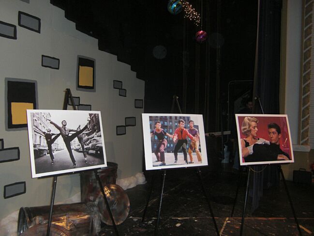 Stage decorated with scenes from George's movies