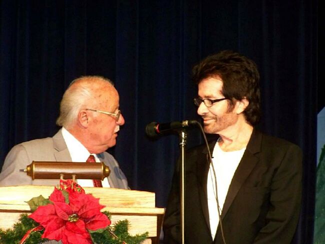 Mayor Williams presents the proclamation declaring it George Chakiris Day in Norwood