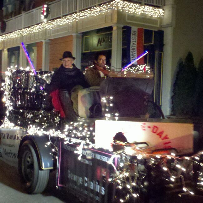 Lee and George riding in the Rose Hill Boutique float - notice the Wallace-Dave foot locker
